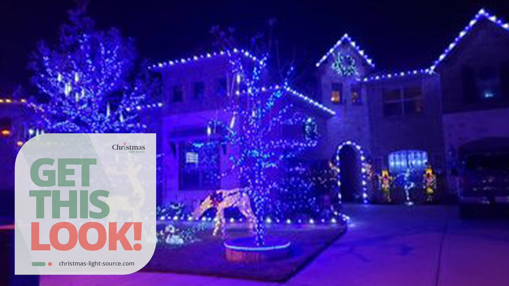 House outlined in blue and white bulbs