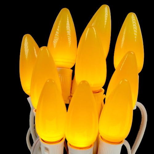 String of yellow light bulbs on a black background