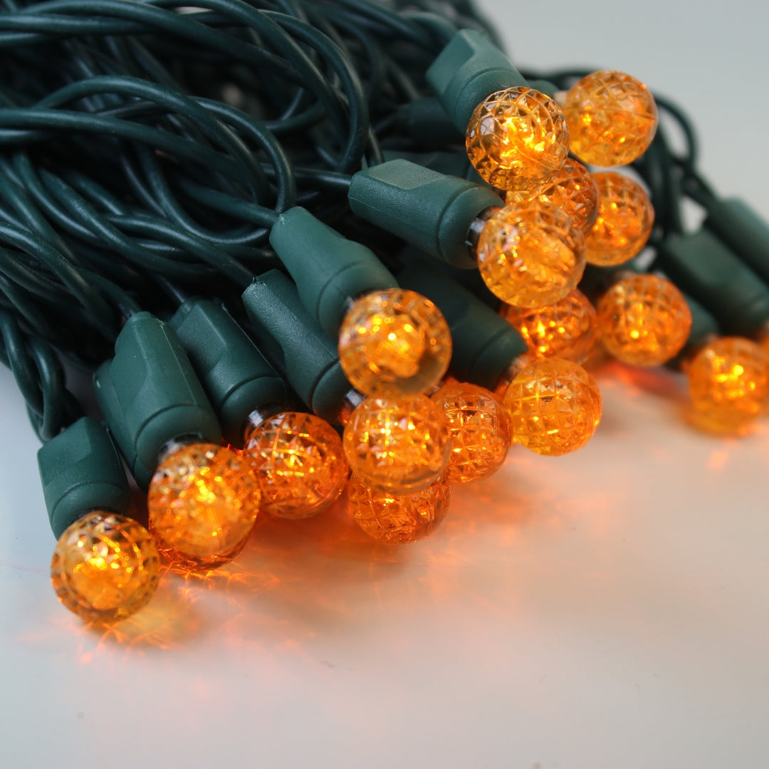 50-light G12 Orange LED Christmas Lights, 4" Spacing Green Wire