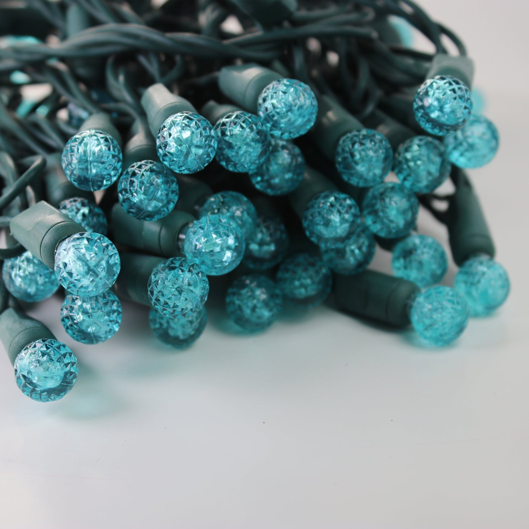 70light G12 Teal LED Christmas Lights, 4" Spacing Green Wire