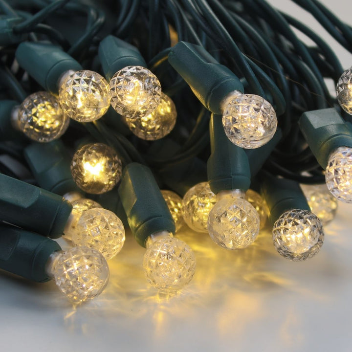 50-light G12 Warm White LED Christmas Lights, 4" Spacing Green Wire